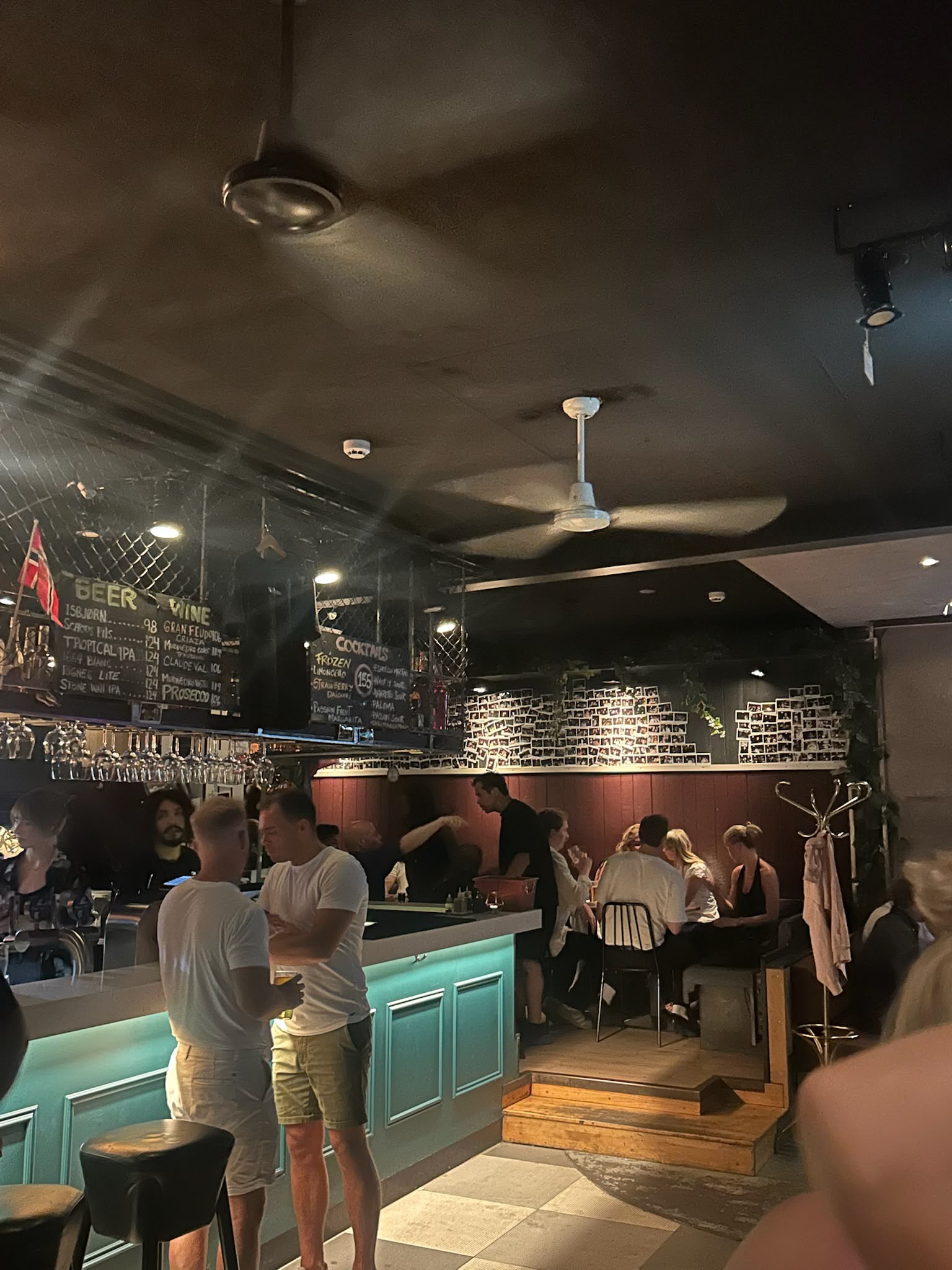 Guests gathering around a colorful Oslo bar